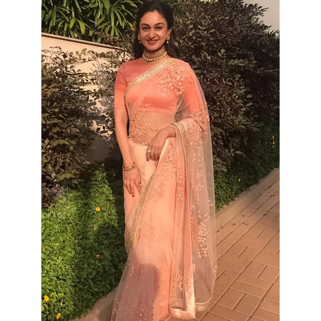 indian girl aishwarya arjun in traditional orange saree blouse